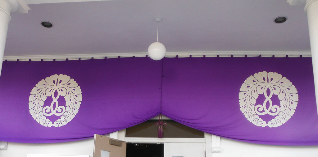 purple banners with wisteria design over open door