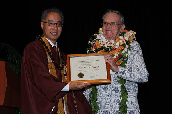 Bishop Matsumoto presents framed award to Paul Leland Breese