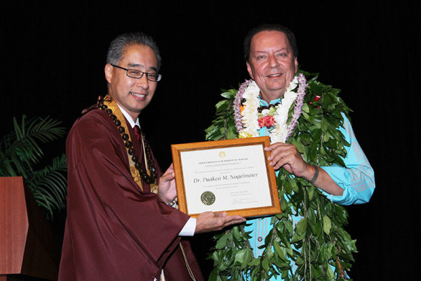 Bishop Matsumoto presents Puakea M. Nogelmeier a framed award