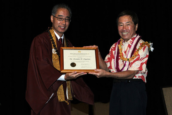 Bishop Matsumoto presents framed award to Dennis Ogawa