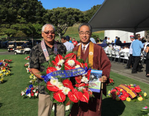Pieper Toyama and Bishop Matsumoto hold a wreath to be presented on behalf of the Missiona at Punchbowl