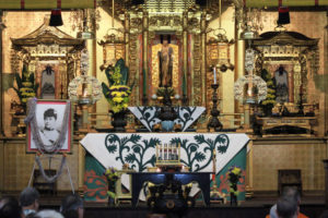 altar area with Queen Liliuokalani portrait for 100th Anniversary Tribute Service