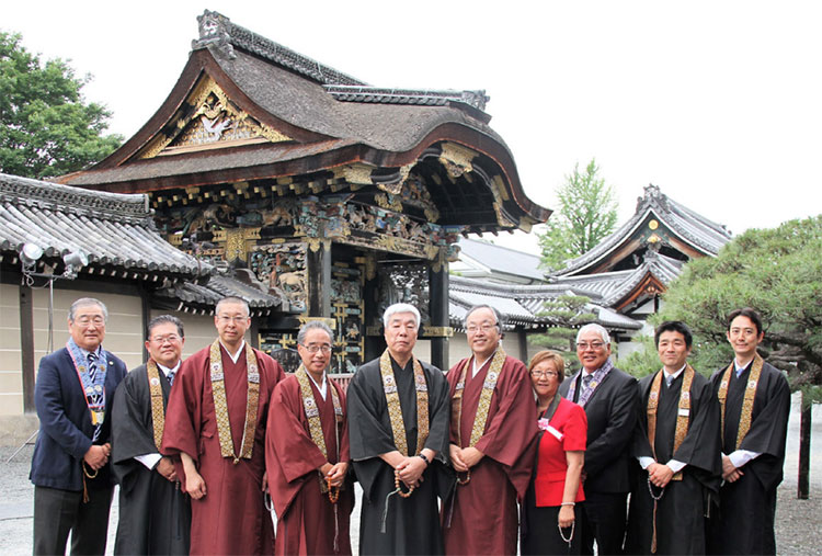 Honpa Hongwanji bishops, presidents, and other representatives in robes outside Honzan in Kyoto at the 35th World Jodo Shinshu Coordinating Council meeting