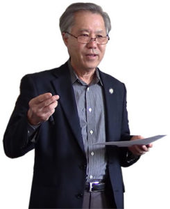 Dr. Kenneth Tanaka (image is from a talk at the Living Dharma Center in 2014 (Canada)).