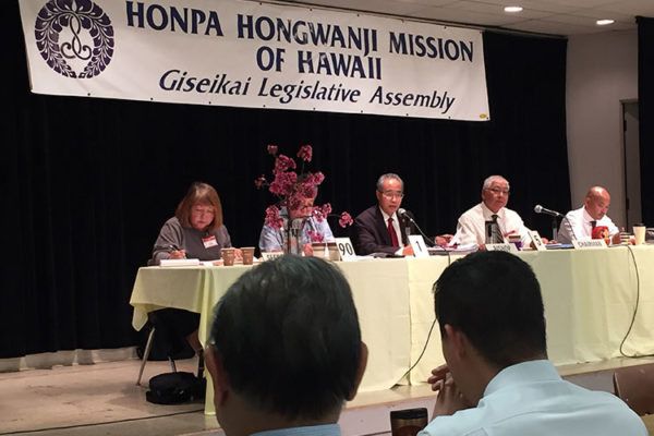 Giseikai 2019, our annual legislative assembly - the presiding table on stage under the banner