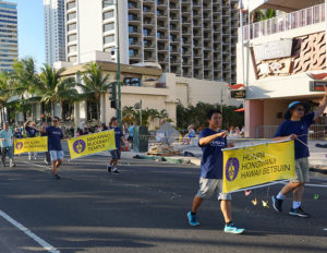 Pan Pacific Festival Parade - walking with temple banners