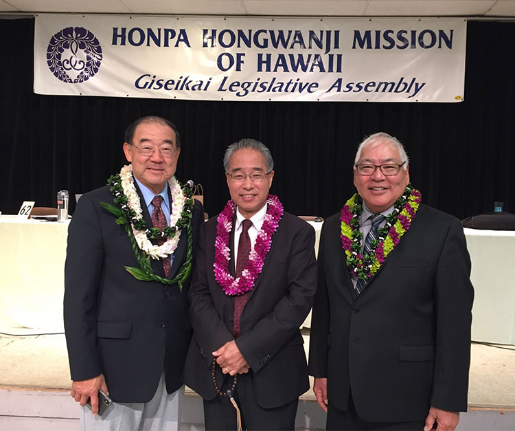 Incoming HHMH president Warren Tamamoto, Bishop Eric Matsumoto, and outgoing president Pieper Toyama