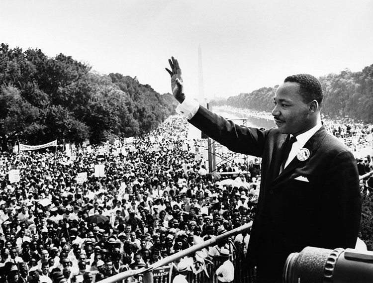 Martin Luther King Jr. waves to the crowd from the Lincoln Memorial at the 8/28/63. Source: https://commons.wikimedia.org/wiki/File:USMC-09611.jpg
