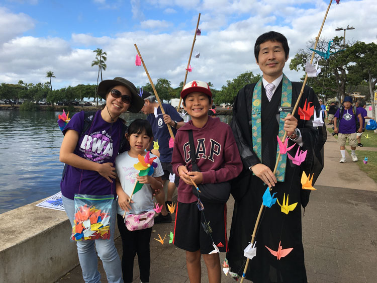 A Hongwanji minister and family ready to begin at Magic Island