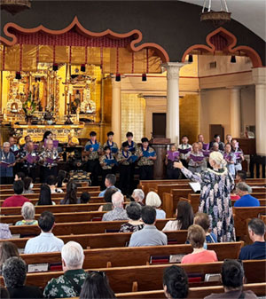 Nola Nahulu conducts at the Choralfest 2025 Music Service