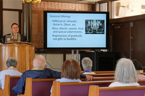 Rev. Shawn Yagi explains special altar elements at Līhu’e Hongwanji